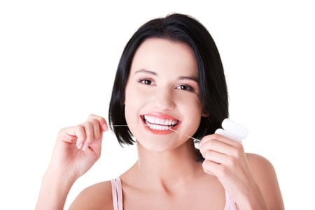 woman whitening teeth