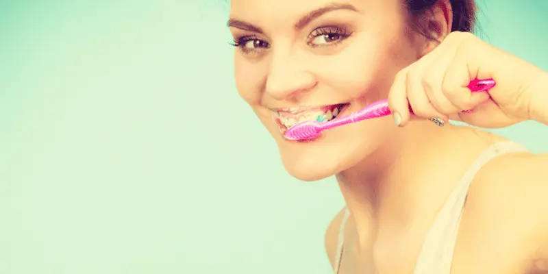Woman Brushing her Teeth